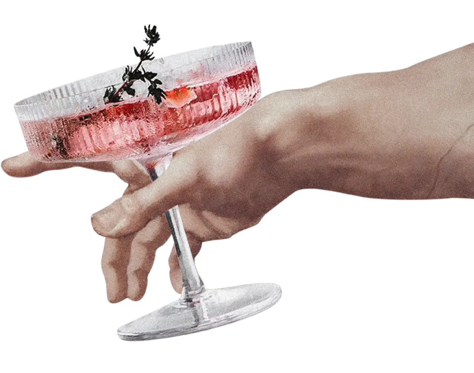 Hand entering from the right of the screen holding a cocktail